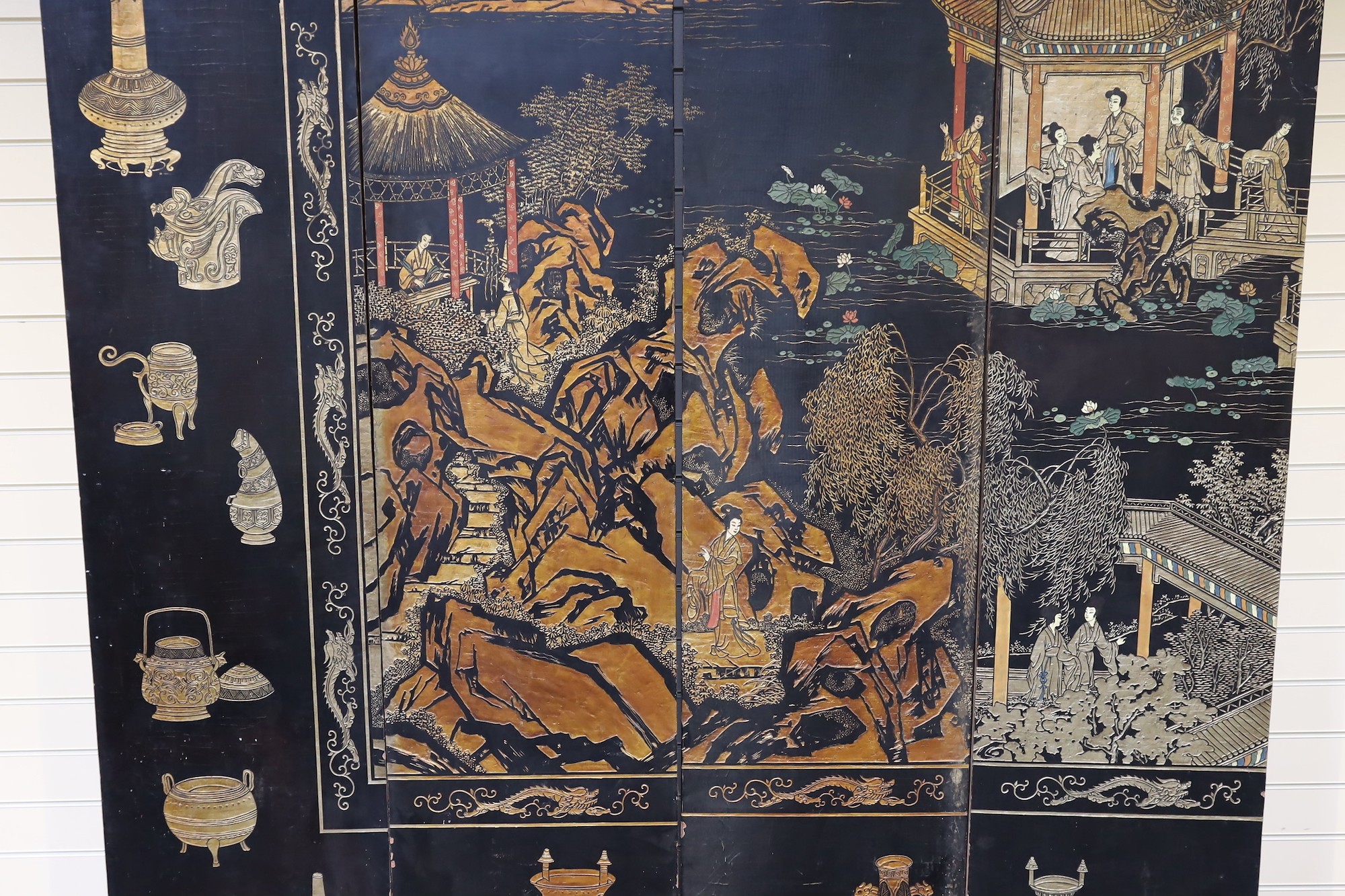 A tall Chinese coromandel lacquer twelve panel screen, 19th century, each leaf panel width 49cm, height 264cm